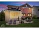 Outdoor space with lounge chairs on patio and grill; covered porch visible in background at 1013 Domino Dr, Carmel, IN 46032