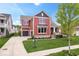 Charming two-story home featuring a landscaped front yard, covered porch, and attached two-car garage at 1013 Domino Dr, Carmel, IN 46032