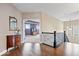 Spacious foyer leads into the home with hardwood floors and iron-railed staircase at 1013 Domino Dr, Carmel, IN 46032