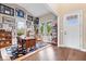 Bright home office with hardwood floors, lots of windows, and custom shelving at 1013 Domino Dr, Carmel, IN 46032