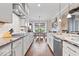 Spacious kitchen showcasing modern appliances, granite countertops, and a view into the dining area at 1013 Domino Dr, Carmel, IN 46032