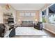 Comfortable living room with hardwood floors, a large window, and stylish furnishings at 1013 Domino Dr, Carmel, IN 46032