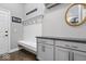 Well-organized mudroom with built-in bench, storage cabinets, and coat hooks at 1013 Domino Dr, Carmel, IN 46032