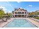 Community pool with lounge chairs and a clubhouse in a well-maintained neighborhood at 1013 Domino Dr, Carmel, IN 46032