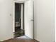 Neutral carpeted bedroom with white walls and an open doorway to the bathroom at 1020 E Sixth St, Greenfield, IN 46140