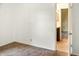 Neutral carpeted bedroom with white walls and an open doorway to the bathroom at 1020 E Sixth St, Greenfield, IN 46140
