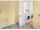 A laundry room featuring a modern, front-loading Samsung washer and dryer at 1020 E Sixth St, Greenfield, IN 46140