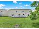 Lush backyard with green lawn and wood deck offers ample space for outdoor activities and relaxation at 10828 Young Lake Dr, Indianapolis, IN 46229