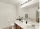 Well-lit bathroom featuring a double vanity and large mirror, offering a functional and stylish space at 10828 Young Lake Dr, Indianapolis, IN 46229
