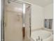 Bathroom showcasing a glass-enclosed shower and separate soaking tub, designed for relaxation at 10828 Young Lake Dr, Indianapolis, IN 46229
