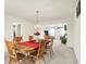 Formal dining room featuring traditional wooden table with seating for six under a chandelier at 10828 Young Lake Dr, Indianapolis, IN 46229