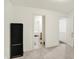 Neutral hallway offers access to a bathroom, bedroom, and additional room beyond at 10828 Young Lake Dr, Indianapolis, IN 46229