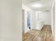 Bright hallway with wood floors providing seamless transitions throughout the home at 10828 Young Lake Dr, Indianapolis, IN 46229