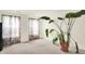 Bright and inviting living room showcasing large windows and neutral decor, creating a cozy and welcoming space at 10828 Young Lake Dr, Indianapolis, IN 46229