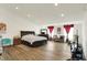 Large main bedroom with wood floors, natural light, and ample space at 10828 Young Lake Dr, Indianapolis, IN 46229