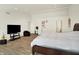 Sun-filled main bedroom boasting a TV, sitting area, and ample open space at 10828 Young Lake Dr, Indianapolis, IN 46229