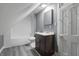 A quaint bathroom features a vanity, toilet, and tub/shower combo, all efficiently arranged at 1130 W Congress Ave, Indianapolis, IN 46208