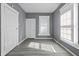 Bright bedroom featuring neutral walls, modern flooring, and a window for natural light at 1130 W Congress Ave, Indianapolis, IN 46208
