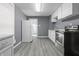 Bright kitchen with white appliances, ample cabinetry, modern oven and stove, and neutral walls at 1130 W Congress Ave, Indianapolis, IN 46208