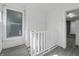 Bright and airy enclosed porch features a wall of windows and neutral walls at 1130 W Congress Ave, Indianapolis, IN 46208