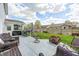 Spacious backyard with a patio area, outdoor seating, and a well-maintained lawn at 11419 Pegasus Dr, Noblesville, IN 46060