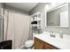 Well-lit bathroom with a modern vanity, neutral walls, and a shower with curtain at 11419 Pegasus Dr, Noblesville, IN 46060