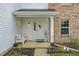 Charming home entrance features a decorated front door, bench, and well-manicured landscaping at 11419 Pegasus Dr, Noblesville, IN 46060