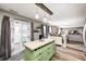 Modern kitchen boasts wood floors, a green island with butcher block top, and an open floor plan at 11419 Pegasus Dr, Noblesville, IN 46060