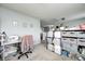 Cozy craft room with sewing machine, storage shelves, and natural light at 11419 Pegasus Dr, Noblesville, IN 46060