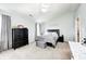 Spacious main bedroom with a bed, dresser, and soft, neutral color palette at 11419 Pegasus Dr, Noblesville, IN 46060