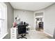 Home office featuring a white desk, gray walls, and a window for natural light at 11419 Pegasus Dr, Noblesville, IN 46060