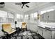 Bright sunroom with white paneling, black and white floor tiles, and lots of windows at 11419 Pegasus Dr, Noblesville, IN 46060