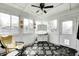 Bright sunroom with white paneling, black and white floor tiles, and lots of windows at 11419 Pegasus Dr, Noblesville, IN 46060