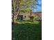 Expansive backyard featuring a wooden deck with pergola and mature trees, creating a private oasis at 11620 E 75Th St, Indianapolis, IN 46236