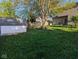 Spacious backyard with shed and mature trees, providing ample space for recreation and gardening at 11620 E 75Th St, Indianapolis, IN 46236