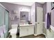 Bathroom featuring a vanity with sink, toilet, and decorative wall art at 11620 E 75Th St, Indianapolis, IN 46236