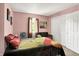 Bedroom featuring a bed, windows, and a closet at 11620 E 75Th St, Indianapolis, IN 46236