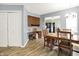 This charming dining room includes a workstation, wood floors and a view into the living room at 11620 E 75Th St, Indianapolis, IN 46236