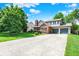 View of a two-story home with an attached two-car garage and a long concrete driveway at 11620 E 75Th St, Indianapolis, IN 46236