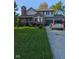 Charming two-story home with brick facade, attached garage, and well-maintained front yard at 11620 E 75Th St, Indianapolis, IN 46236