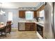 Well-lit kitchen with stainless steel appliances, ample cabinet space, and dining area access at 11620 E 75Th St, Indianapolis, IN 46236