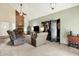 Spacious living room with a brick fireplace, high ceilings, and neutral carpet at 11620 E 75Th St, Indianapolis, IN 46236