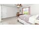 Cozy bedroom features a ceiling fan, rocking chair, and a large window offering natural light at 12092 Sugar Creek Rd, Noblesville, IN 46060