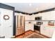 Updated kitchen boasts stainless steel appliances, white cabinets, and hardwood floors at 12092 Sugar Creek Rd, Noblesville, IN 46060