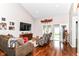 Cozy living area with hardwood floors, comfortable seating, and natural light at 12092 Sugar Creek Rd, Noblesville, IN 46060