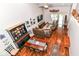 Open-concept living area with hardwood flooring, dining set, and comfortable seating at 12092 Sugar Creek Rd, Noblesville, IN 46060
