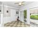 Bright sunroom featuring sliding doors to the patio, and checkered flooring at 12092 Sugar Creek Rd, Noblesville, IN 46060