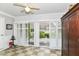 Bright sunroom featuring sliding doors to the patio, and a neutral ceiling fan at 12092 Sugar Creek Rd, Noblesville, IN 46060