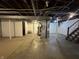 Unfinished basement with exposed ceiling, visible ductwork, and mechanical equipment in a well-lit space at 1309 N Colorado Ave, Indianapolis, IN 46201