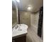 Bathroom featuring a vanity with a white porcelain sink and a bathtub with shower and skull shower curtain at 1309 N Colorado Ave, Indianapolis, IN 46201
